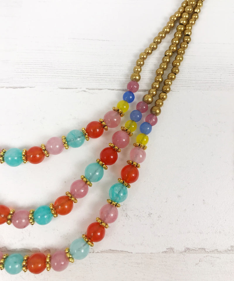 Collar bronce bolitas rosas
